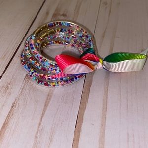 Little girls clear rubber rainbow confetti bracelets